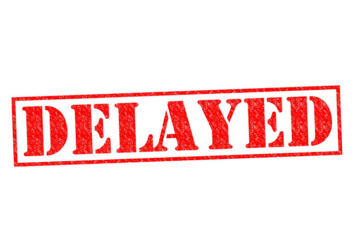 shutterstock_216567715.jpg featured image Red delayed stamp on white background