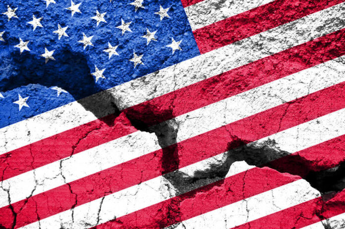 shutterstock_485930149.jpg featured image Cracked United States flag on textured surface.