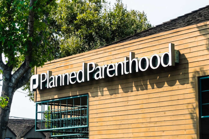 shutterstock_1153115801.jpg featured image Planned Parenthood building with a wooden exterior