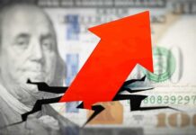 Red arrow breaking through hundred dollar bill