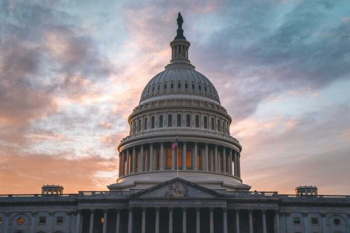 shutterstock_2470608247.jpg featured image Capitol building under cloudy sunset sky