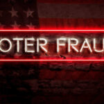 Trump SUES to BLOCK Voter Fraud! Neon sign reading Voter Fraud on American flag background.