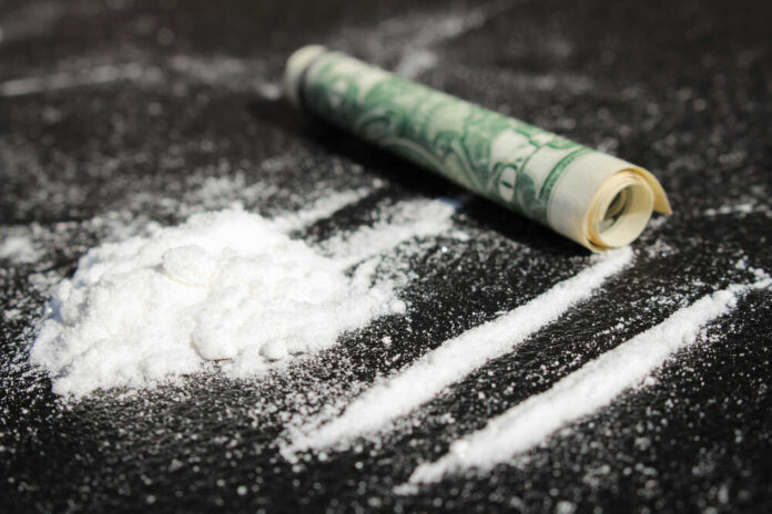 shutterstock_217852807.jpg featured image Cocaine lines with rolled banknote on surface