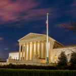The United States Supreme Court building at dusk.