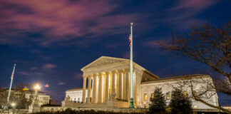 The United States Supreme Court building at dusk.