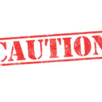 Red caution sign with grunge texture diagonal