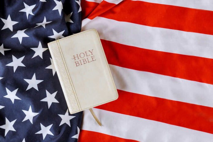 shutterstock_1739139314.jpg Bible on an American flag background
