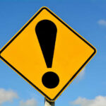 Barge Collision Kills Kids: Miami Demands Justice Yellow caution sign with exclamation mark symbol
