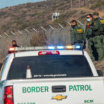 L.A. ARRESTS: Caught Red-Handed Sabotaging Border Patrol! Border Patrol officers detaining individuals near a fence.