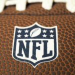 NFL Super Bowl Ticket Scandal Explodes Close-up of NFL logo on American football
