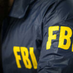 FBI agent in navy blue jacket