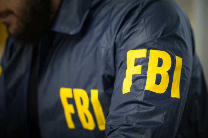 FBI agent in navy blue jacket