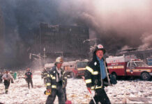 Firefighters at World Trade Center debris aftermath.