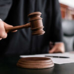 Grocery Store BLOODBATH — Four Life Sentences Handed Down Judge holding gavel in courtroom