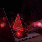 Tech Crash Unleashed Nationwide Air Travel Chaos Warning symbol over laptop with user