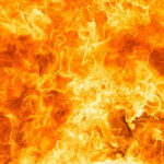 Century-Old Buildings Engulfed in Fiery Chaos – Heroes Hurt Bright orange and yellow flames burning intensely