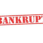 Auto Industry MELTDOWN — Bankruptcy Tsunami! Red stamped word bankrupt on white background
