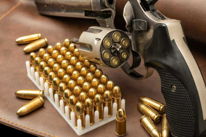 Revolver and bullets on a leather surface