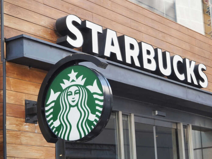 shutterstock_2424822809.jpg Starbucks cafe exterior with logo and sign