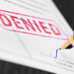 Ghislaine Maxwell CRUSHED — No Escape Now Denied stamp and pen signing document
