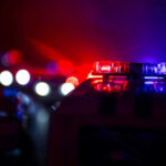 Federal Raid EXPOSES Criminal Alien Underworld Police car lights shining in the dark