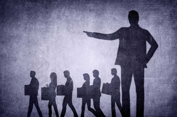 Shadows of laid-off workers walking, large figure pointing