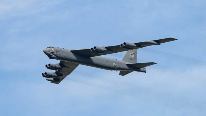 B-52 bomber flying against a blue sky
