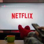 Netflix Star Coach Shot On Campus Person watching Netflix with remote and drink.