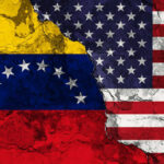 Venezuela MILITARIZES Amidst TRUMP Navy Showdown Cracked Venezuela and USA flags side by side