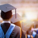 College Degrees WORTHLESS — Students Crushed Students at graduation ceremony wearing caps and gowns.