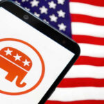 Republican elephant logo on phone, American flag background.