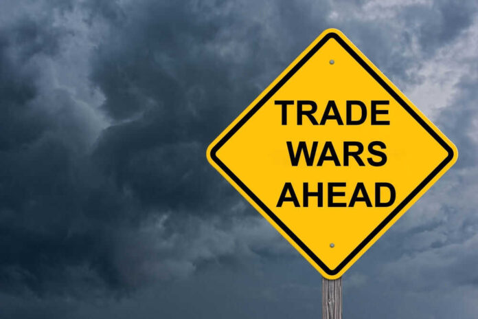 Yellow warning sign reads Trade Wars Ahead