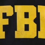 FBI Director’s Girlfriend Trips Probed FBI logo displayed in large yellow letters on a black background