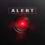 ALERT: CONTAMINATED Meat Shipped Across America Red alert light against black background, text ALERT.