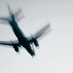 Aviation Crisis Reveals SHOCKING Government Priorities Airplane in flight with motion blur.