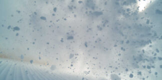 Snowflakes and snow particles in motion during a winter sports activity