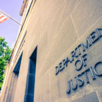 DOJ’s 1% Epstein Review Sparks Cover-Up Fears Department of Justice building with American flag.