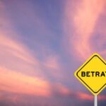 Senate Republicans BETRAY Trump A yellow warning sign with the word 'BETRAY' against a colorful sunset sky