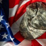 Military to Minneapolis? Shocking Federal Move Looms Camouflage military cap resting on an American flag