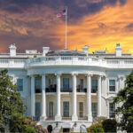 UPDATE: White House DEMANDS Full Control The White House with vibrant sunset sky.