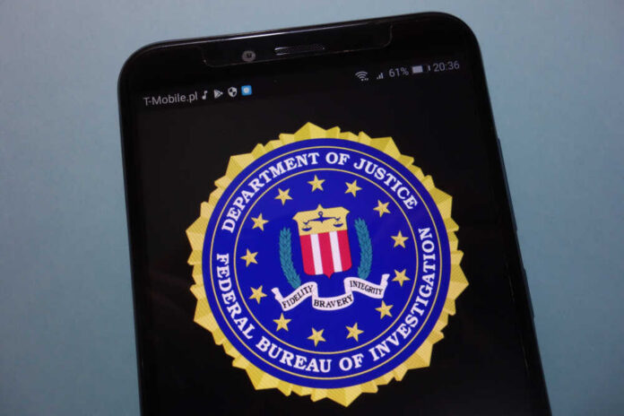 shutterstock_1180791520.jpg FBI logo displayed on a smartphone screen