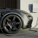 All-Electric Supercar Plan KILLED Electric car charging at a station.