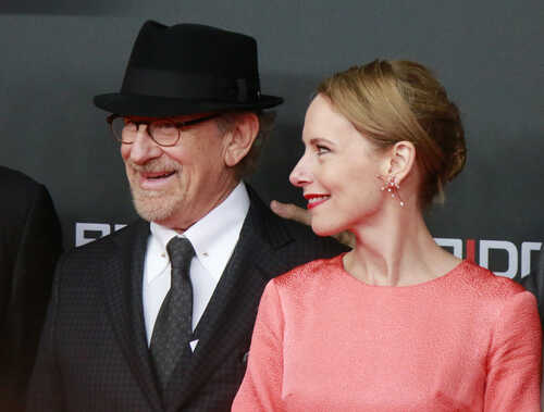 Steven Spielberg and Amy Ryan smiling at a red carpet event