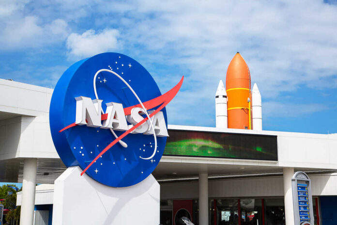 NASA logo with a space shuttle in the background