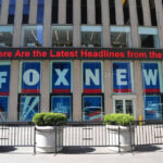 Fox News building with scrolling LED headline display.