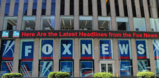 Fox News building with scrolling LED headline display.