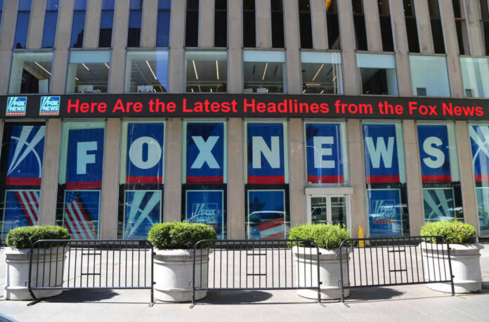 Fox News building with scrolling LED headline display.