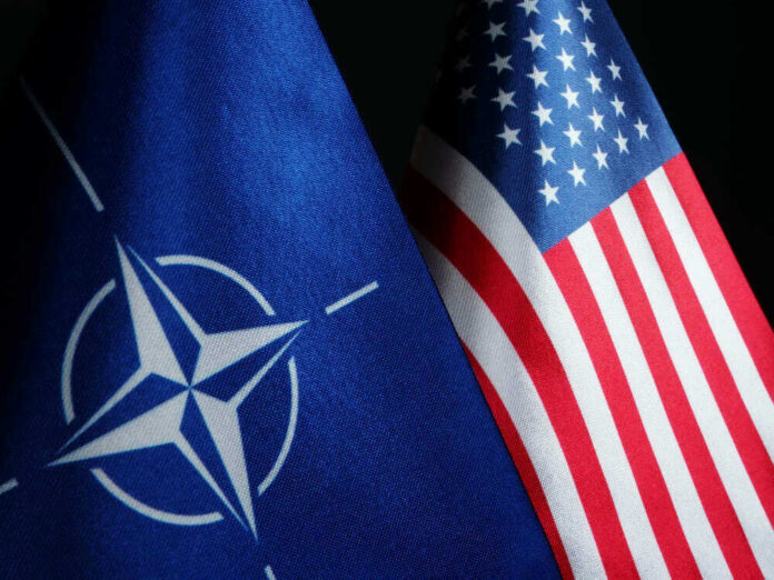 NATO flag and United States flag side by side.