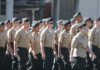 Group of youth cadets marching in uniform during a parade