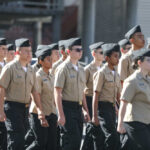 Group of youth cadets marching in uniform during a parade